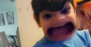Little boy horrified at seeing himself with a Snapchat-filter
