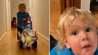 Running toddler wipes out after crashing his toy airplane