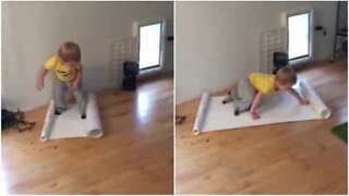 Toddler can't do Christmas gift wrapping