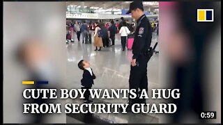 Cute boy wants a big from security guard