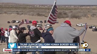 Trump supporters form human wall