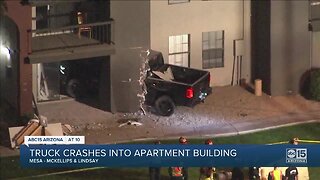 Truck crashes into apartment building