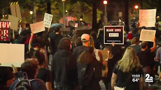 People march through Downtown Baltimore protesting police violence against Black people