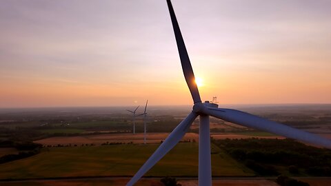 Wind turbines at sunset reveal the majestic beauty of wind farms