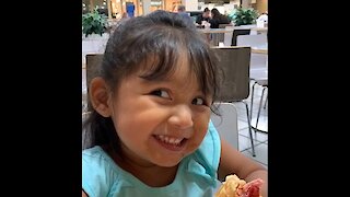 Cute little girl adorably tells us it's delicious