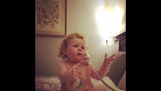 Sweet Little Girl Adorably Rambles On The Telephone