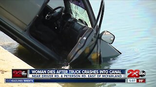 Woman dies after truck crashes into canal