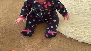 Cute baby chooses real items over toy items
