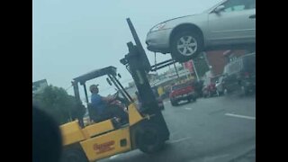 Forklift truck takes vehicle towing to new heights