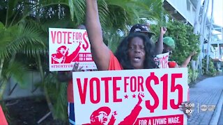 Low-income workers celebrating Florida's minimum wage hike