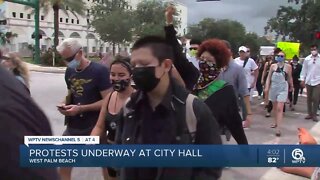 Protesters march through downtown West Palm Beach