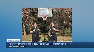 Officers deliver basketball hoop to kids