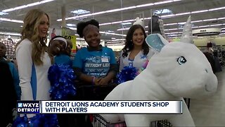 Detroit Lions Academy students shop with players