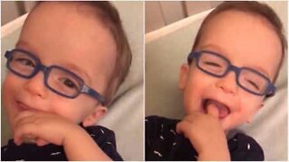 Baby wears glasses and sees clearly for the first time