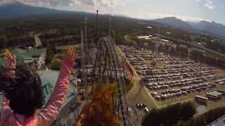 Thrilling roller coaster ride filmed from passenger seat
