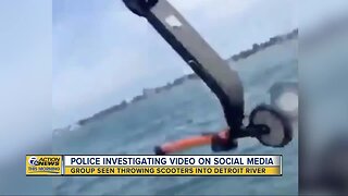 Viral video shows group throwing scooter into Detroit River