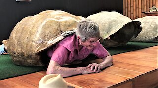 Very inspiring 82-year-old grandma squeezes into giant tortoise shell