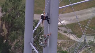 First responders rescue artist from water tower in Dunedin