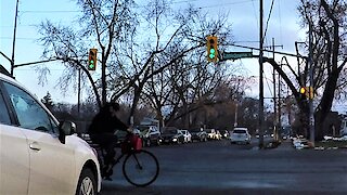 Oblivious cyclist runs red light, has close call with SUV