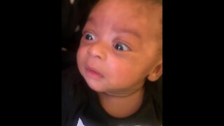 Baby in shock as he watches a video of himself crying
