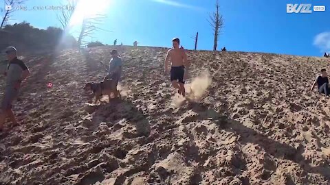 Guy backflips down sand dune at alarming speed 3