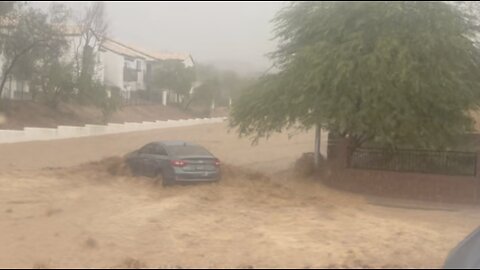 Pregnant woman's car swept away by flood waters in east Las Vegas
