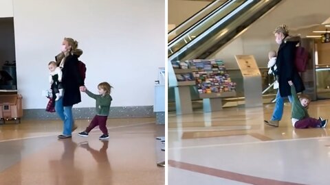 Fed-up mom literally drags her kid through the airport