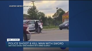 Video: Man charges at Detroit police with sword