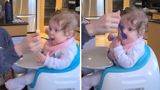Baby's first time eating from a spoon is absolutely hilarious