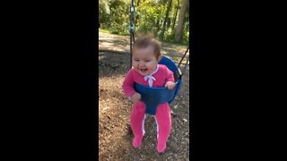 Baby Girl Can't Stop Giggling During First Ever Swing Ride