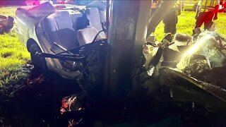 Firefighters remove person pinned from crash on Daniels Parkway