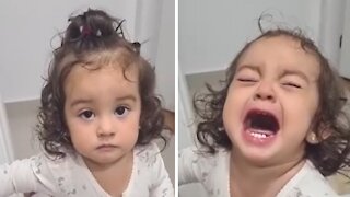 Emotional baby can't hold back the tears when mom sings