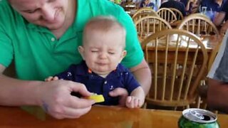 Hilarious moment baby tries lemon for the first time