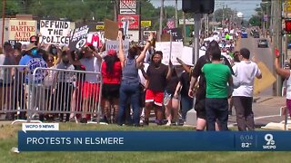Protesters march along Dixie Highway to Elsmere PD