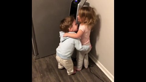 Twins love rocking out in front of the fan