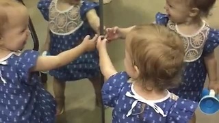Adorable Baby Girl Showers Her Own Mirror Reflection With Kisses