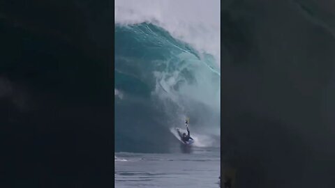 Big surge caught a surfer and nearly a jetski! Insane ride!