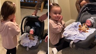 Emotional big sister meets baby brother for the first time