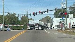 Truck almost gets hit by train