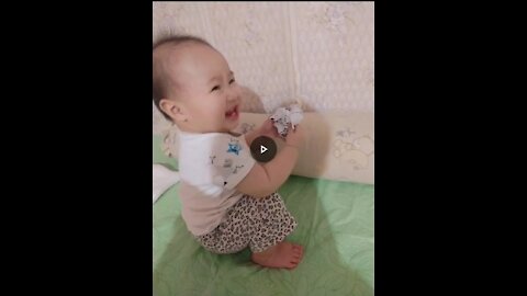Baby girl gets excited when she gets something she likes