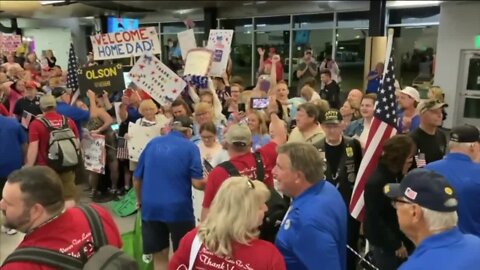 Families welcome home veterans aboard the Old Glory Honor Flight