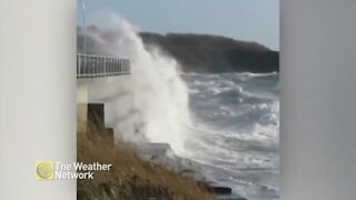 Waves crash against bridge during B.C. wind storm