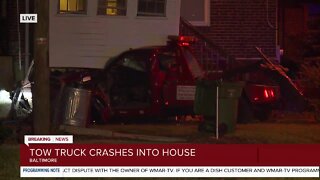 One person seriously injured after a tow truck crashes into a home