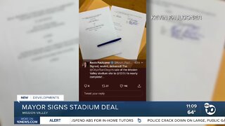 Mayor signs stadium deal