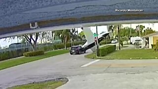Surveillance camera captures moment small plane crashes into vehicle in Pembroke Pines