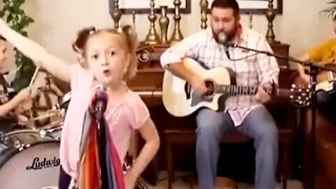 Little Girl Sings with Passion