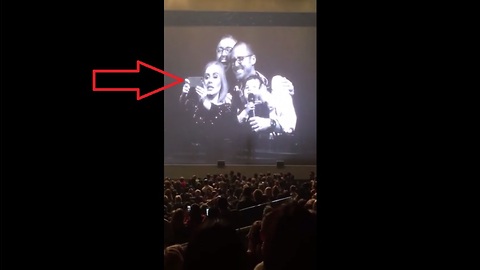 Adele invites gay dads and their baby on stage for a selfie at Toronto concert
