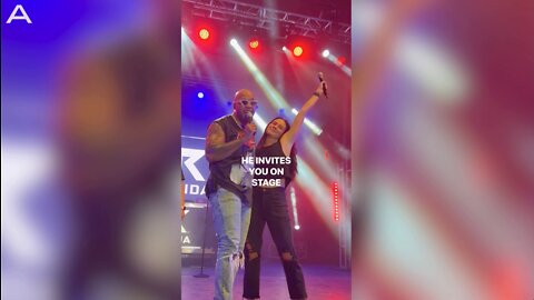 Woman Performs On Stage With Flo Rida During Concert