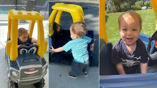 Toddler safely inspects vehicle before going on ride