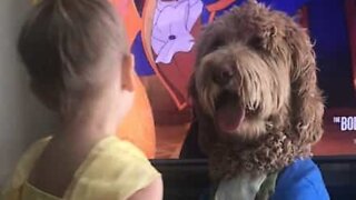Little girl and her dog recreate Disney movie scene